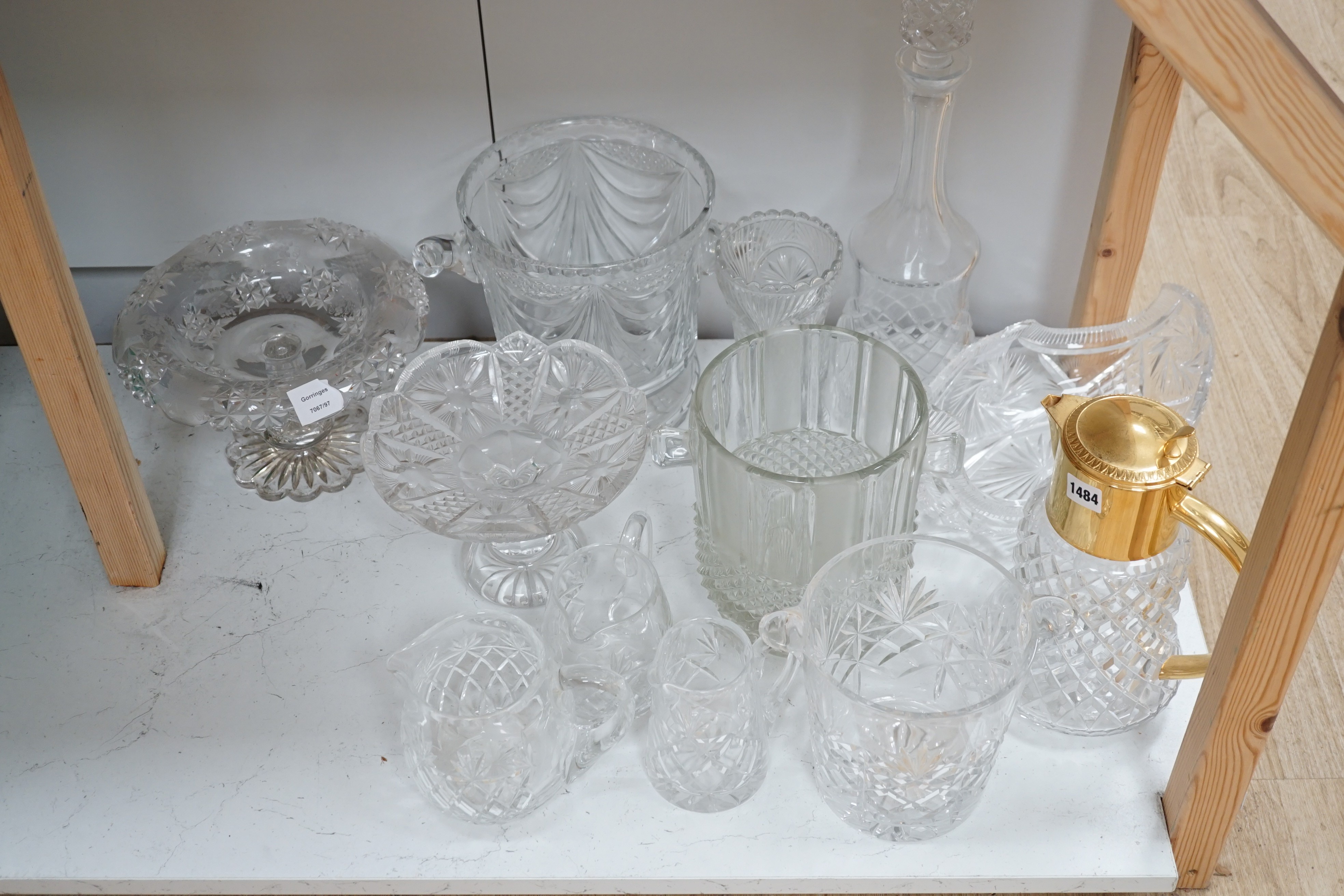 Three assorted cut glass ice buckets, two pedestal dishes, a gilt metal mounted lidded jug etc